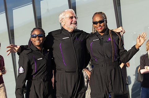 Space tourists, from left, Anastatia Mayers, Jon Goodwin and Keisha Schahaff pose for photos before boarding their Virgin Galactic flight (Photo | AP)