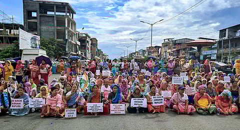 Meira Paibis, a collective of Meitei women, on Friday staged sit-in demonstrations across five districts of Imphal Valley in protest against the alleged gangrape. (Photo | PTI)