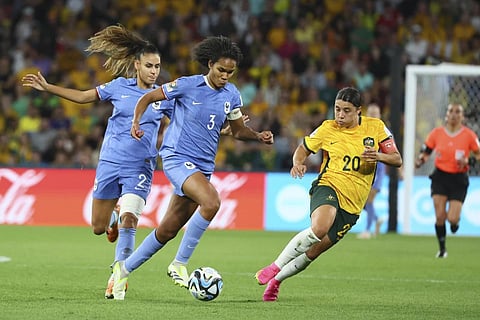 Australia's Sam Kerr, right, challenges for the ball with France's Wendie Renard, centre, during the Women's World Cup quarterfinal soccer match in Brisbane, Australia, Aug. 12, 2023. (Photo | AP)