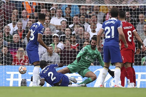Chelsea's Axel Disasi scores the equalising goal past Liverpool's goalkeeper Alisson during the English Premier League soccer match between Chelsea and Liverpool. (Photo | AP)