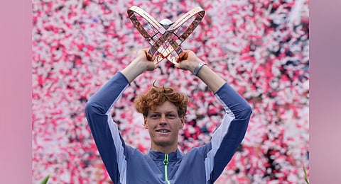 Jannik Sinner holds the trophy after defeating Alex de Minaur to win the men's final of the National Bank Open tennis tournament in Toronto. (Photo | AP)