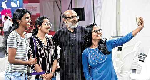 Young delegates taking a selfie with former minister T M Thomas Isaac at a conclave held at the Freedom Fest 2023 in Thiruvananthapuram on Sunday. (Photo | B P Deepu)