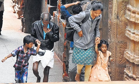 Pilgrims go in groups and parents accompany their children while trekking the Tirumala temple on Sunday. (Photo | Madhav K)