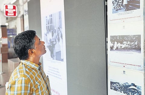A man looks at images of the Partition at a digital photo exhibition in Kacheguda railway station on Monday. (Photo | Sri Loganathan Velmurugan)