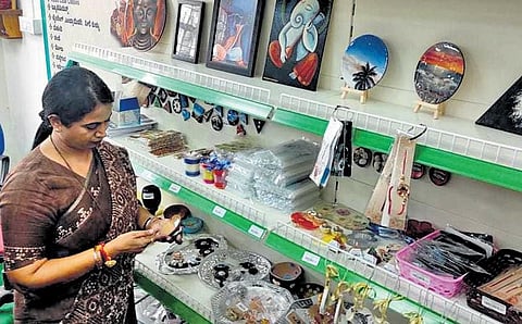 Women and Child Development Minister Laxmi Hebbalkar looks at handmade products on display for sale at the supermarket in Udupi on Monday | express