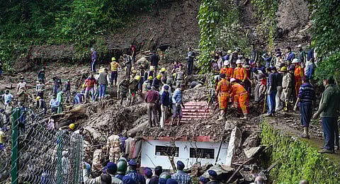Rescue and relief work underway after collapse of a temple following a massive landslide near Summer Hill in Shimla. (Photo | PTI)