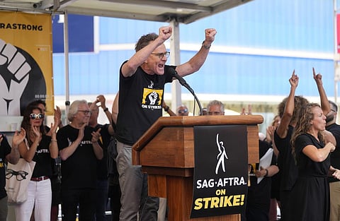 Actor Bryan Cranston speaks during the SAG-AFTRA 'Rock the City for a Fair Contract' rally in Times Square. (Photo | AP)