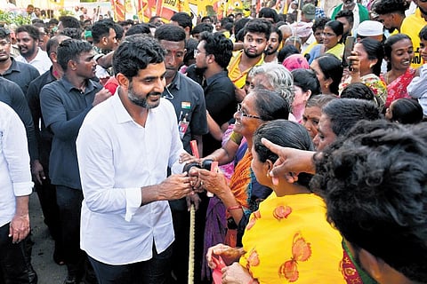 TDP general secretary Nara Lokesh greets people during his Yuva Galam Padayatra at Nidamarru in Guntur district on Tuesday I Prasant Madugula
