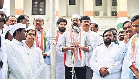 TPCC chief A Revanth Reddy addresses the gathering after hoisting the national flag at the Gandhi Bhavan in Hyderabad on Tuesday. (Photo | Express)