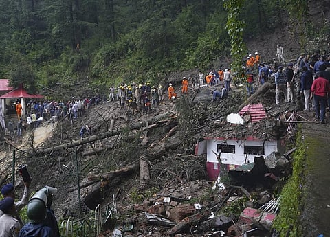 Rescuers remove mud and debris as they search for people feared trapped after a landslide near a temple on the outskirts of Shimla, Himachal Pradesh, Monday, Aug.14, 2023. (Photo | AP)