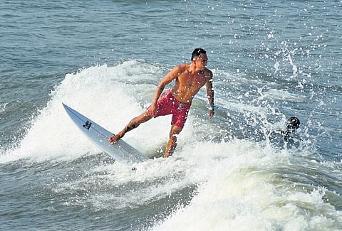 Surfers during an evening practice session at World Surfing leaugue in Mahabalipuram | file picture