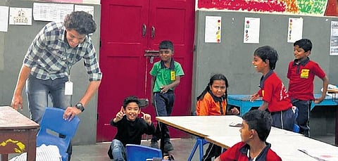 A teacher interacts with students during a class at the Shradhanjali Integrated School in Bengaluru | Express
