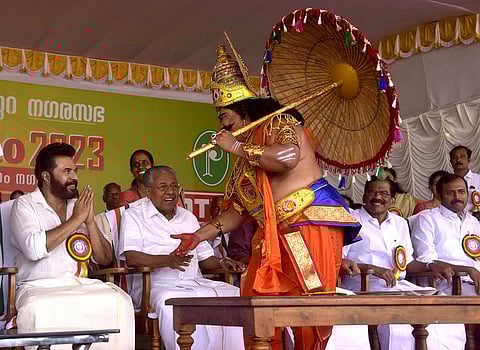 Kerala Chief Minister Pinarayi Vijayan is all smiles as ‘Mahabali’ extends his hands to greet actor Mammootty at the Athachamayam celebration in Tripunithura on Sunday. (Photo | A Sanesh)