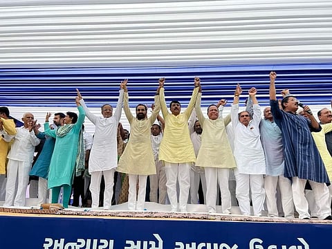 Gujarat Congress leader Amit Chavda with other party leaders at a sit-in organised in Gandhinagar. (Photo | Special Arrangement)