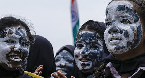 Students of Everwin School with their faces painted with moon celebrate the pre-soft landing of Chandrayaan- 3, in Chennai. (Photo | PTI)