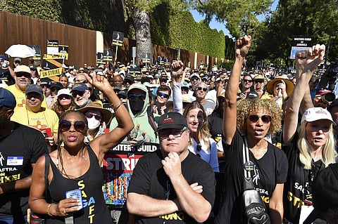 Sean Astin, center, Michelle Hurd, second right, and marchers attend the Day of Solidarity union rally, August 22, 2023. (Photo | AP)