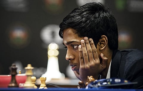 Indian Grandmaster R Praggnanandhaa and during the first game of the Chess World Cup 2023 final against Norway's Grandmaster and World No. 1 player Magnus Carlsen, in Baku. (FILE | PTI)