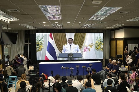 New Prime Minister Srettha Thavisin, seen on tv screen, deliver a speech, after paying respect to the portrait of King Maha Vajiralongkorn, as he receives the royal endorsement ceremony. (Photo | AP)