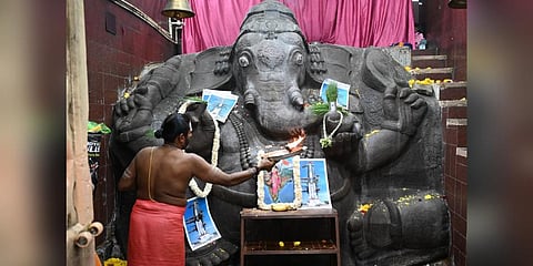 Members of Chamarajpet Janapara Vedike and several volunteers performed pooja at Ganesha temple in Bengaluru on the eve of the Chandrayaan-3 Mission landing on the lunar surface | Express