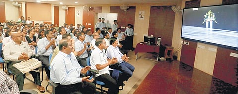 CTTC general manager L Rajasekhar with his staff celebrating landing of Chandrayaan-3 on moon surface, at the centre’s office in Bhubaneswar. (Photo | Shamim Qureshy, EPS)