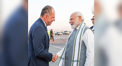 Prime Minister Narendra Modi (R) is warmly greeted by FM George Gerapetritis (L) at the airport. (Photo | Twitter, @MEAIndia)