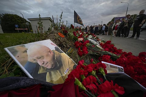 A portrait of the owner of private military company Wagner Group Yevgeny Prigozhin lays at an informal memorial next to the former 'PMC Wagner Centre' in St. Petersburg, Russia, Thursday. (AP)