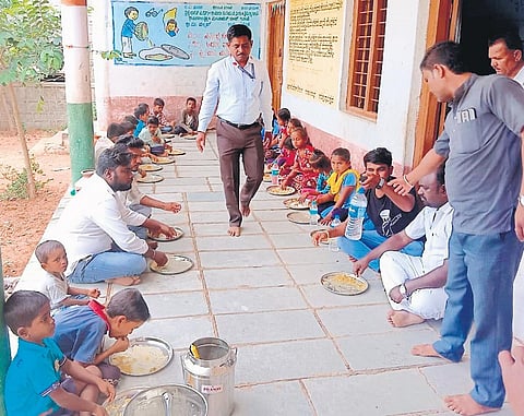 Students of the Government Primary School at Chennur village in Yadgir district having their midday meal on Wednesday | Express