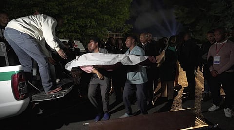 This videograb shows a body being brought to hospital in Antananarivo on August 25, 2023 following a stampede at a stadium where at least 13 people, including seven children were killed. (Photo | AFP)