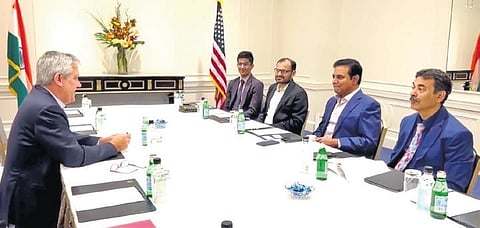 IT Minister KT Rama Rao speaks to James McGreevy, vice president of public policy, government and regulatory affairs at Coca-Cola, during a meeting in New York