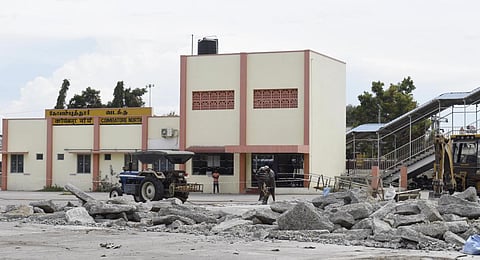 Workers demolishing concrete floor of Coimbatore North Railway station in Coimbatore on Monday. Express/S Senbagapandiyan.