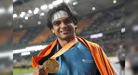 Neeraj Chopra poses after winning the gold medal in the Men's javelin throw final during the World Athletics Championships in Budapest, Hungary, Sunday, Aug. 27, 2023. (Photo | AP)