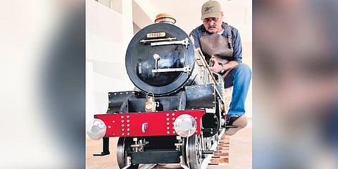 Mechanical engineer Sanjay Wighmal with his miniature steam-powered locomotive engines at his Gurugram society.