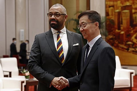 British Foreign Secretary James Cleverly, left, and Chinese Vice President Han Zheng shake hands before a meeting at the Great Hall of the People in Beijing. (Photo | AP)