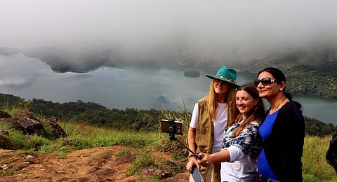 FILE - Foreign tourists take a selfie at the Idukki Dam in Kerala. (Photo | P Mahendran, EPS)