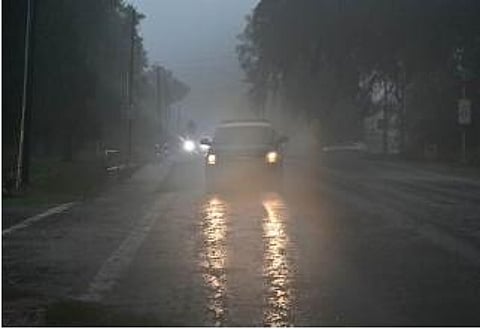 A police car drives through heavy rains in Archer, Florida, on August 30, 2023, after Hurricane Idalia made landfall. (Photo |AFP)