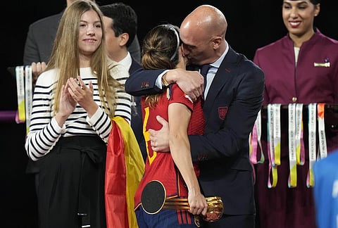 President of Spain's soccer federation, Luis Rubiales, right, hugs Spain's Aitana Bonmati on the podium following Spain's win in the final of Women's World Cup. (Photo | AP)