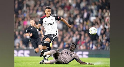 Fulham's Rodrigo Muniz (left) and Tottenham Hotspur's Davinson Sanchez battle for the ball during the Carabao Cup second-round football match. (Photo | AP)