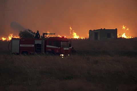 A firefighter operates during a wildfire near the northeastern town of Alexandroupolis, Greece, Sunday, Aug. 20, 2023. (Photo | AP)