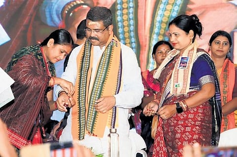 Women tying rakhis to Union Minister Dharmendra Pradhan at Bhuban in Dhenkanal