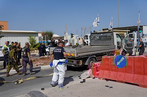 Israeli security forces inspect the scene of a Palestinian ramming attack near West Bank Maccabim checkpoint on Thursday. (Photo | AP)