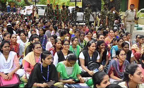 Students in large numbers stage sit in protest in front SVU Vice Chancellors chamber and administrative building. (Photo | Madhav K)