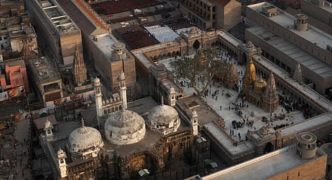 An Aerial view shows Gyanvapi mosque, left, and Kashiviswanath temple on the banks of the river Ganges in Varanasi, India, Dec. 12, 2021.(Photo | AP)