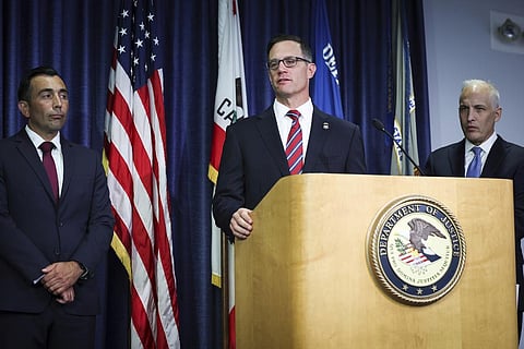 U.S. Attorney Randy S. Grossman for the Southern District of California, center, speaks during a press conference at the U.S. Attorney's Office for the Southern District of California. (AP)
