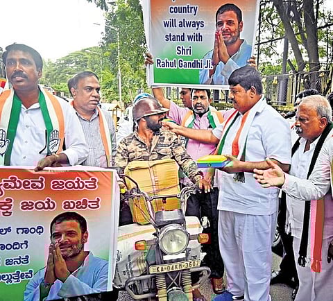 Congress supporters celebrate the Supreme Court’s order staying the conviction of Rahul Gandhi, in Bengaluru on Friday | Shashidhar Byrappa