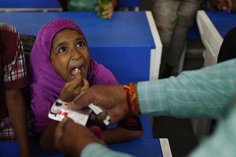 Children intake deworming tablets to prevent intestinal worms at Govt High School in Musheerabad, Hyderabad. (Photo | Sri Loganathan Velmurugan)