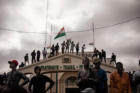 Hundreds of people backing the coup in Niger gathered on August 3, 2023 for a mass rally in the capital Niamey with some brandishing giant Russian flags. (AFP)