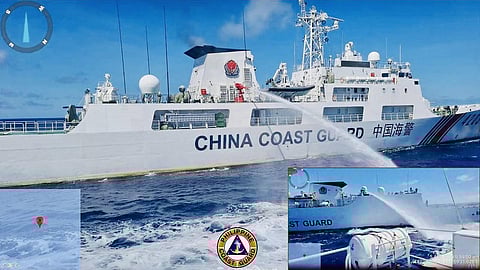 A China Coast Guard ship (L) releasing water cannon on a Philippine Coast Guard ship near Second Thomas Shoal during a re-supply mission on August 5. (AFP)