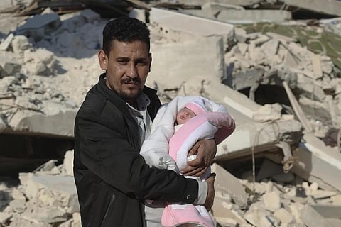 Khalil al-Sawadi holds Afraa, s baby girl who was born under the rubble caused by an earthquake that his Syria and Turkey, February 20, 2023. (Photo | AP)