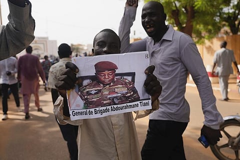 FILE - Nigeriens participate in a march called by supporters of coup leader Gen. Abdourahmane Tchiani, pictured, in Niamey, Niger, Sunday, July 30, 2023. (Photo | AP)