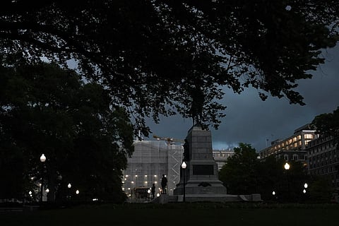 Storm clouds darken the sky over the Treasury Department, center, Monday, Aug. 7, 2023, in Washington. (Photo | AP)